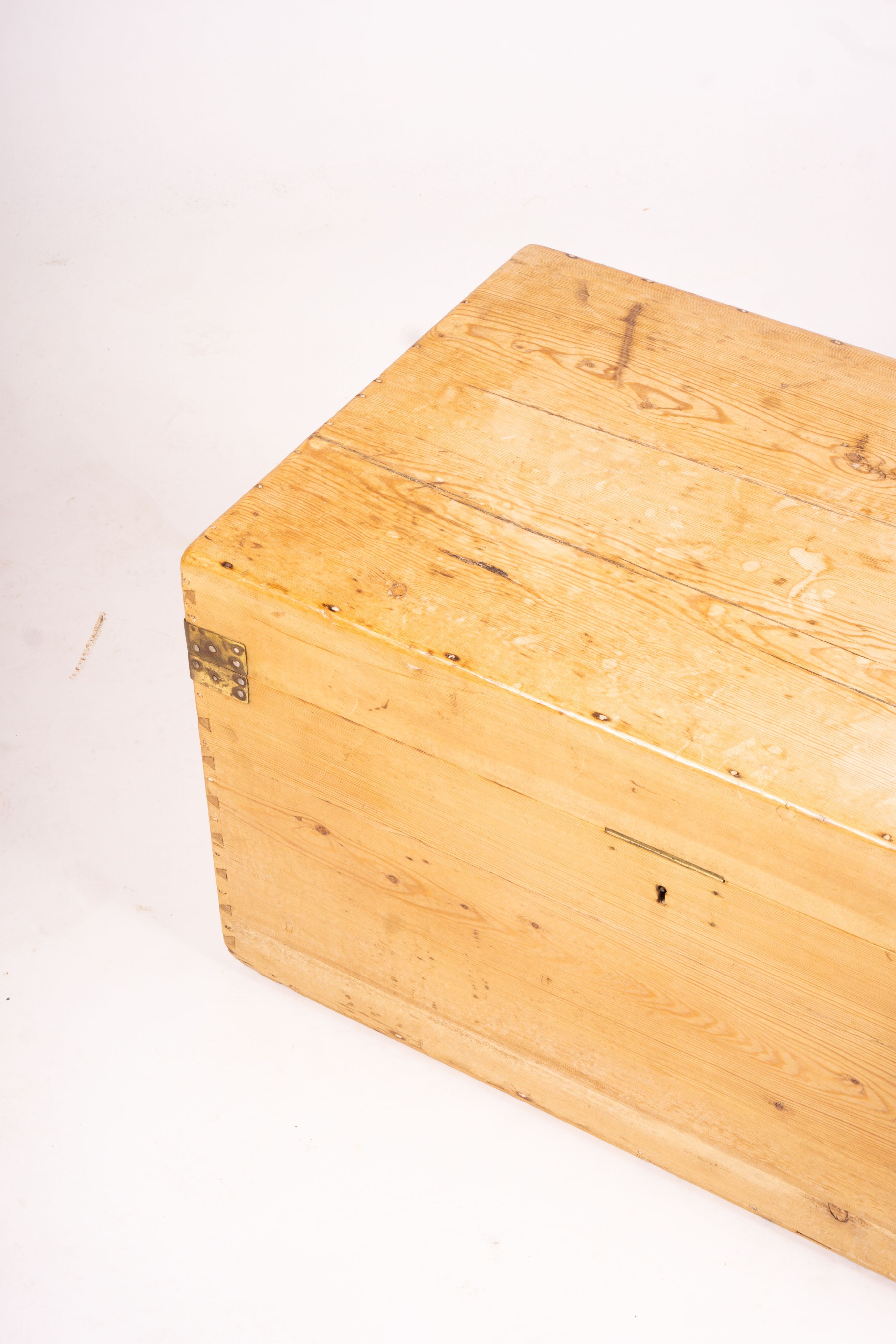 A small Victorian brass bound rectangular pine trunk, length 76cm, depth 46cm, height 42cm